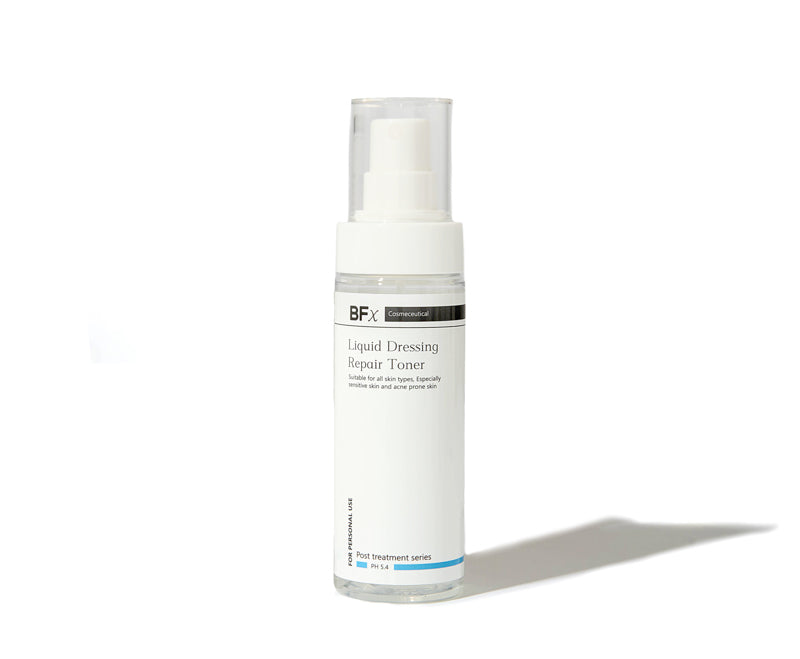 A white cylindrical pump bottle of BFX Liquid Dressing Repair Toner with a clear cap, shown on a clean white background with a soft shadow to the right.