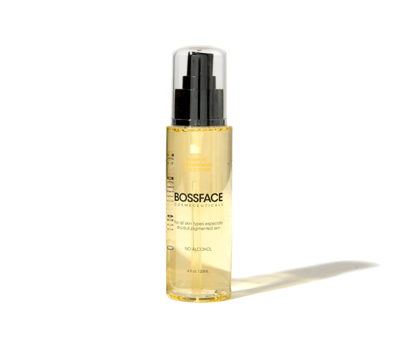 BOSSFACE COSMETICS Turmeric toner in a clear bottle showing the golden-yellow oil inside, with a black pump and clear cap, set against a plain white background with a soft shadow.