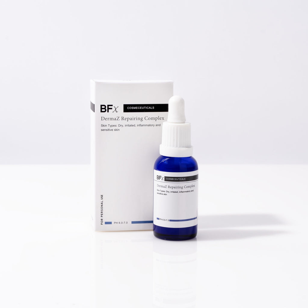 A small blue glass dropper bottle labeled Bfx Dermal Repairing Complex stands in front of its white rectangular box on a clean white studio background.