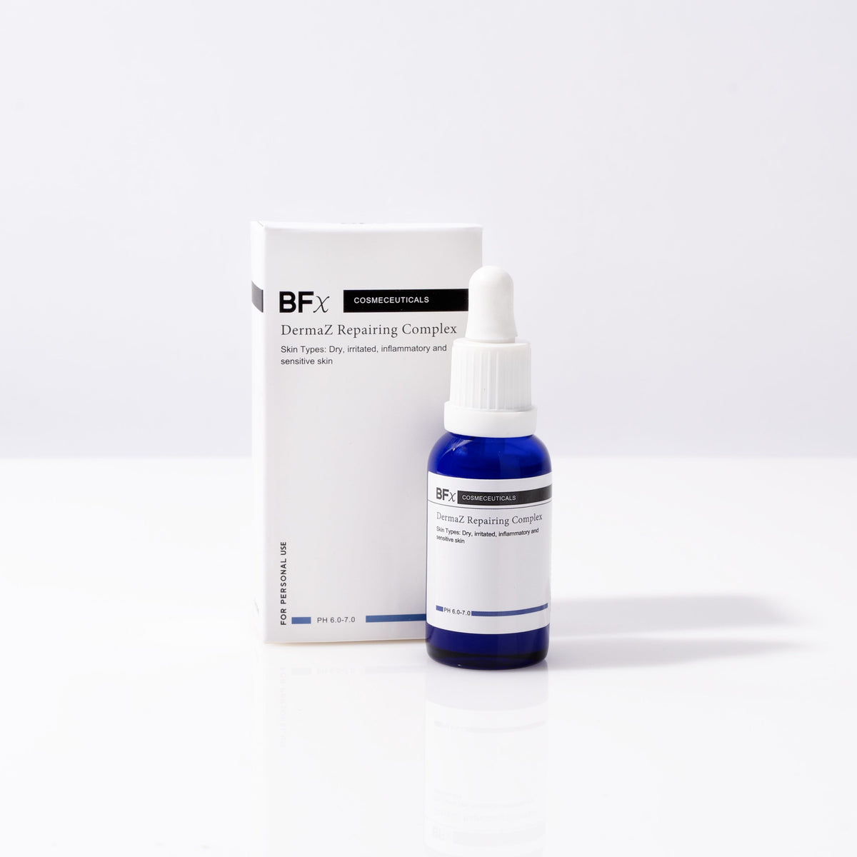 A small blue glass dropper bottle labeled Bfx Dermal Repairing Complex stands in front of its white rectangular box on a clean white studio background.