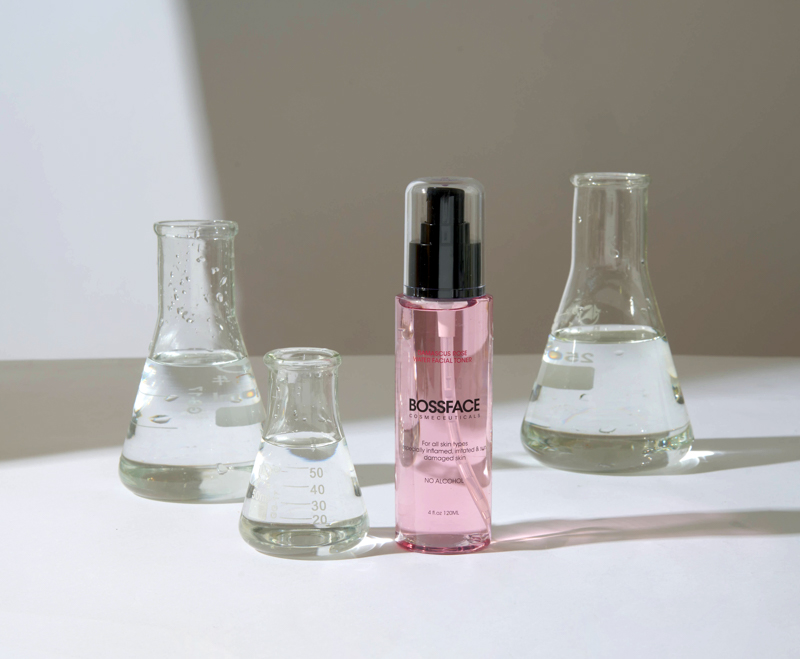 Bossface rose water - lifestyle Bossface rose water with three test tubes filled with water