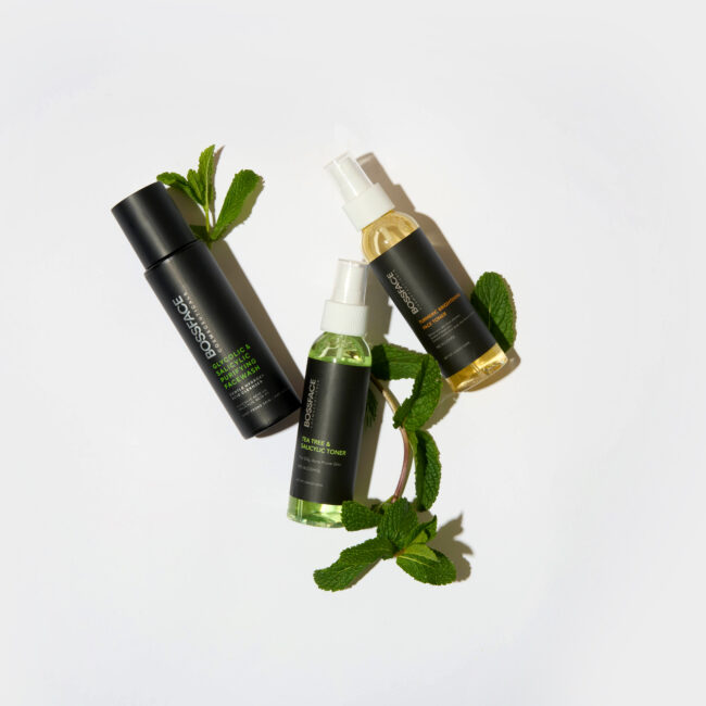 Two Bossface toners and moisturiser on a white surface